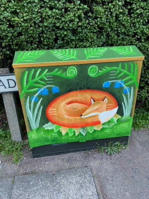 A Fox Curled Up Painted On Utility Cabinet