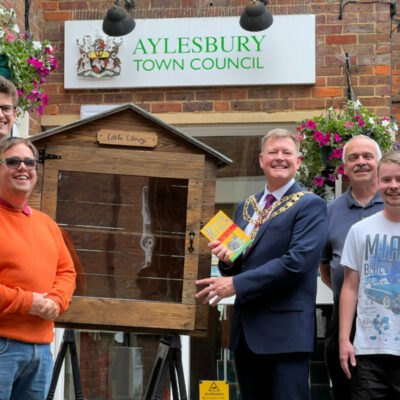 Members From Talkback Uks Accessible Workshop Handing Book Cabinet To Former Town Mayor