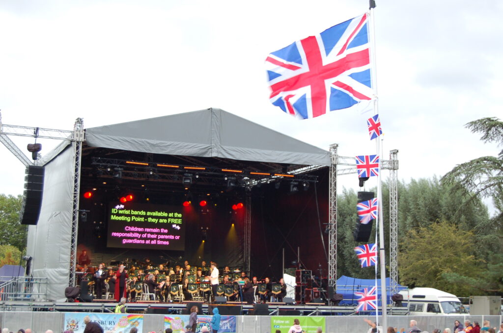 Proms in the park stage with flag